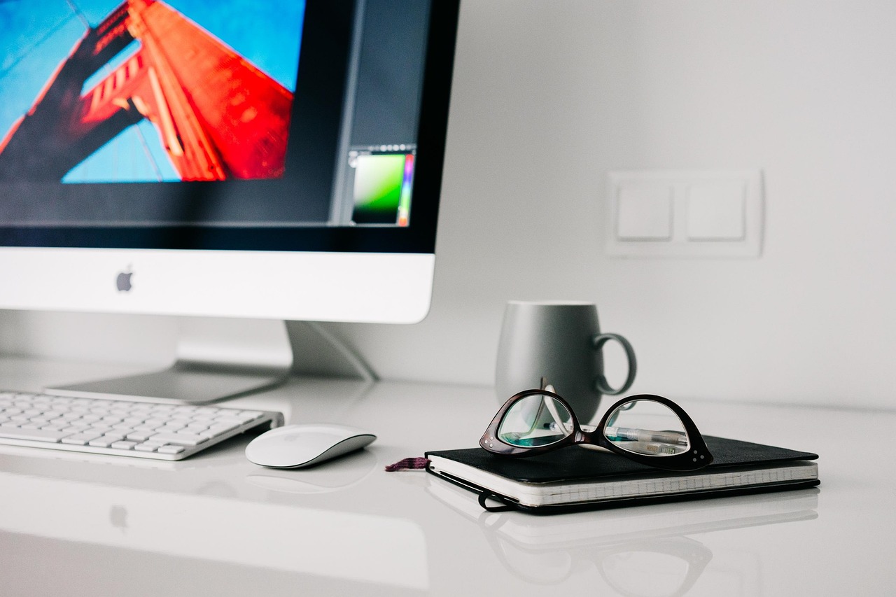 Quiet desk workspace with laptop and natural light